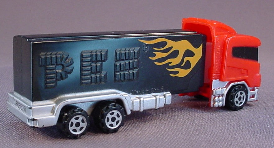 Pez Red Semi Truck With Orange Flames On One Side Of The Black Stem, 2004, Pez Candy Dispenser