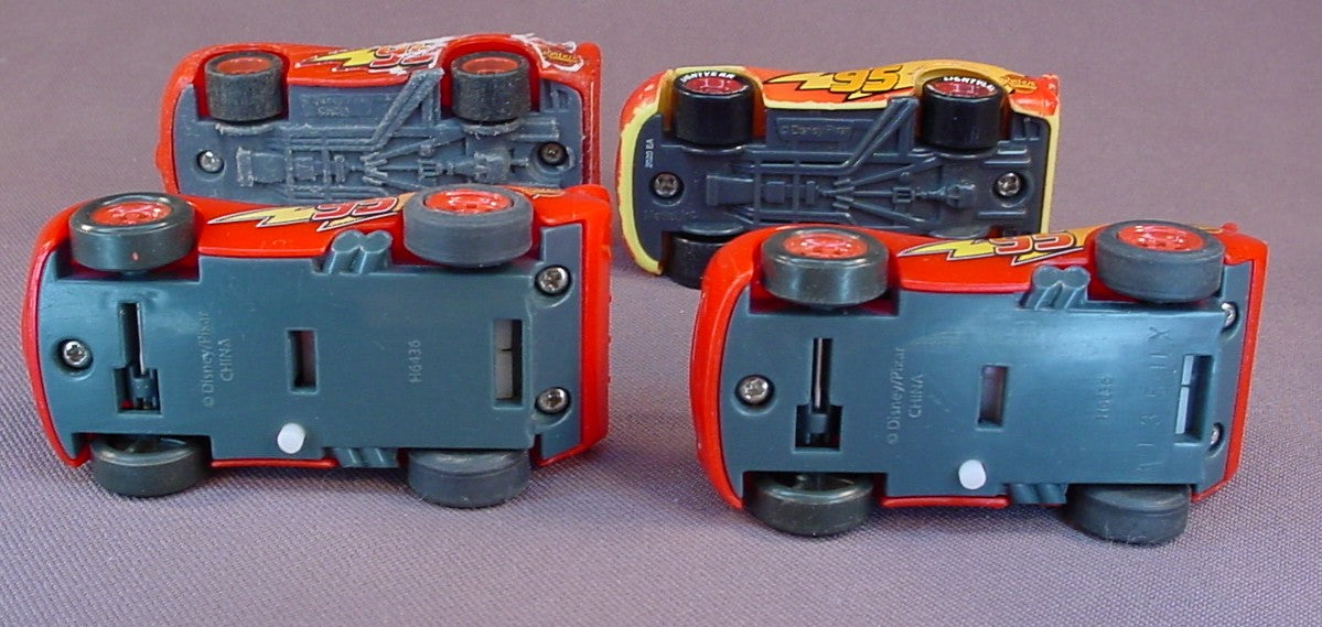 Disney Pixar Cars Movie Lot Of 4 Lightning McQueen Plastic Cars, 3 Inches Long, All Have Some Paint Wear, 2 Have Pull Back Motors