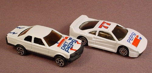 Pair Of White Cars With Pepsi And Diet Pepsi Logos