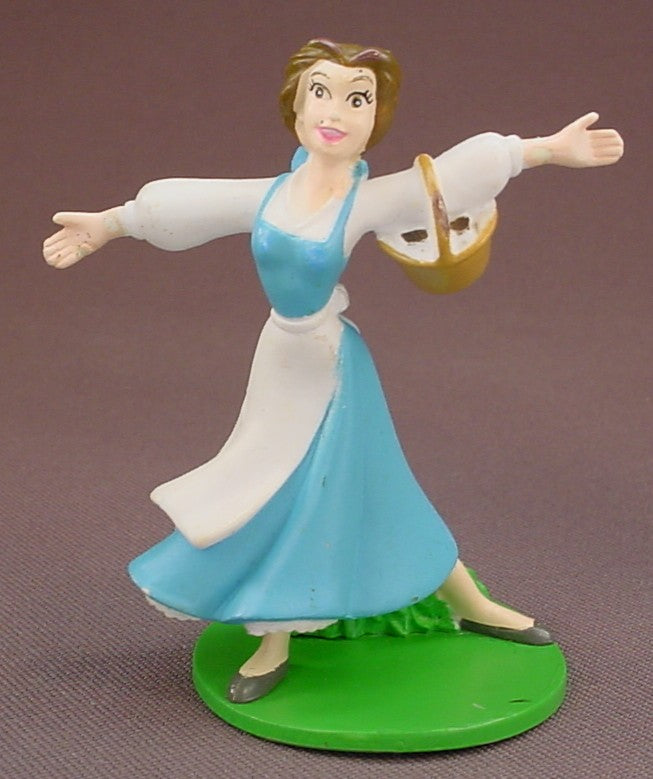 Disney Beauty & The Beast Belle With Her Arms Stretched Out & Holding A Basket PVC Figure On A Green Base, 3 Inches Tall