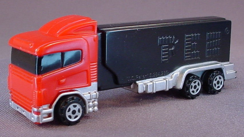 Pez Red Semi Truck With Orange Flames On One Side Of The Black Stem, 2004, Pez Candy Dispenser