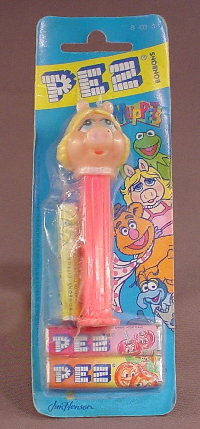 Pez The Muppets Miss Piggy, In The Sealed Cardboard And Plastic Package, Pink Stem, The Cardboard Has Some Curling, Jim Henson