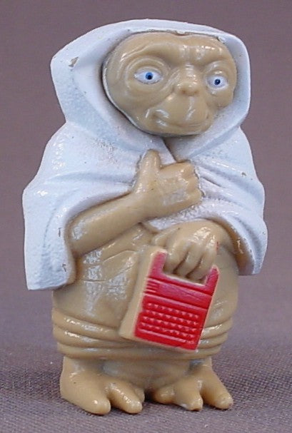 E.T. The Extra-Terrestrial Alien Wearing A White Towel Or Blanket PVC Figure, 2 Inches Tall, He Is Holding A Speak And Spell Toy, 1982 Universal, ET Movie Toy