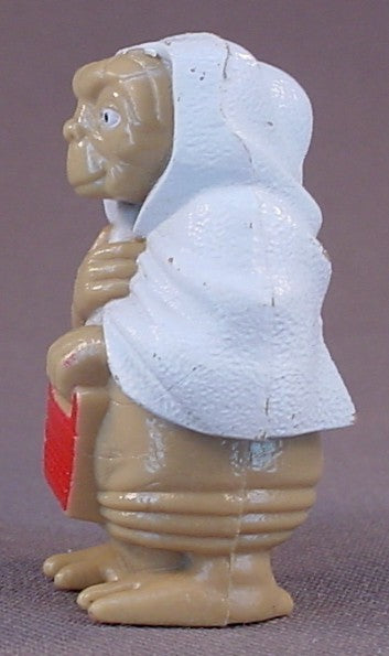 E.T. The Extra-Terrestrial Alien Wearing A White Towel Or Blanket PVC Figure, 2 Inches Tall, He Is Holding A Speak And Spell Toy, 1982 Universal, ET Movie Toy