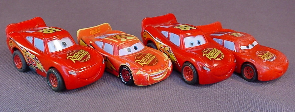 Disney Pixar Cars Movie Lot Of 4 Lightning McQueen Plastic Cars, 3 Inches Long, All Have Some Paint Wear, 2 Have Pull Back Motors