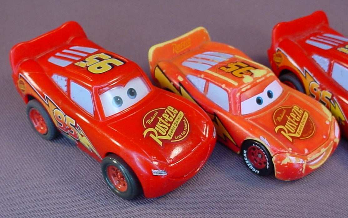 Disney Pixar Cars Movie Lot Of 4 Lightning McQueen Plastic Cars, 3 Inches Long, All Have Some Paint Wear, 2 Have Pull Back Motors