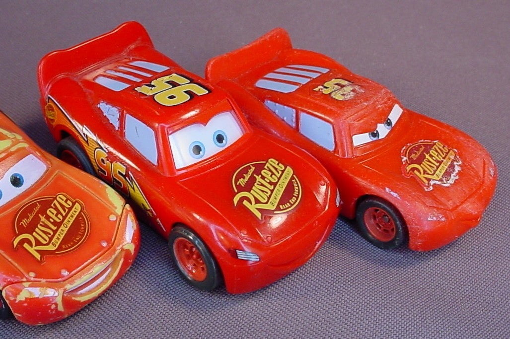 Disney Pixar Cars Movie Lot Of 4 Lightning McQueen Plastic Cars, 3 Inches Long, All Have Some Paint Wear, 2 Have Pull Back Motors