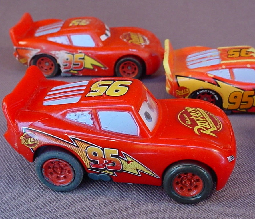 Disney Pixar Cars Movie Lot Of 4 Lightning McQueen Plastic Cars, 3 Inches Long, All Have Some Paint Wear, 2 Have Pull Back Motors
