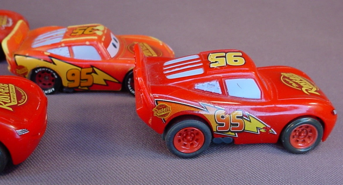Disney Pixar Cars Movie Lot Of 4 Lightning McQueen Plastic Cars, 3 Inches Long, All Have Some Paint Wear, 2 Have Pull Back Motors