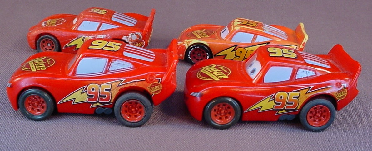 Disney Pixar Cars Movie Lot Of 4 Lightning McQueen Plastic Cars, 3 Inches Long, All Have Some Paint Wear, 2 Have Pull Back Motors