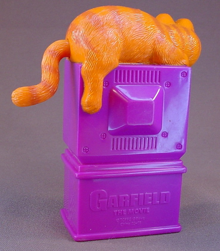 Garfield The Cat Movie Toy With Garfield Laying On Top Of A TV Set, Turn His Tail To Change The Scenes, 4 1/2 Inches Tall, 2004 Wendy's