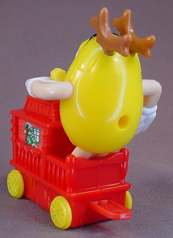 M&M Yellow Figure Riding A Red Train Caboose, 2005 Christmas Train, The Arms Move, 3 1/4 Inches Tall, M & M Candy, M And M
