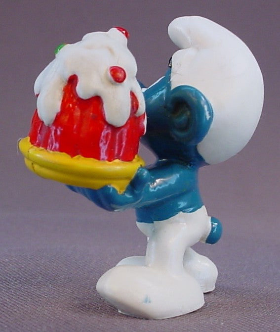 Smurf Holding A Red Cake With Green & Red Dots On A Yellow Plate PVC Figure, Jell-O Mold, #20100, 1973 Peyo Schleich, W. Berrie & Co., Made In Hong Kong, Smurfs, Vintage, Figurine