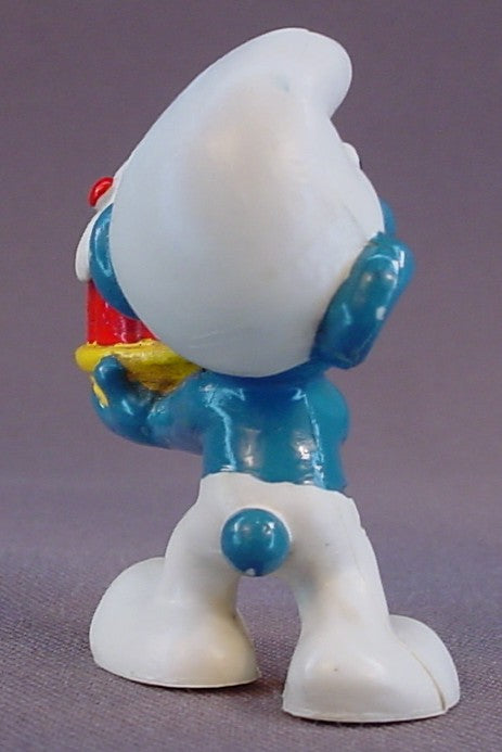 Smurf Holding A Red Cake With Green & Red Dots On A Yellow Plate PVC Figure, Jell-O Mold, #20100, 1973 Peyo Schleich, W. Berrie & Co., Made In Hong Kong, Smurfs, Vintage, Figurine