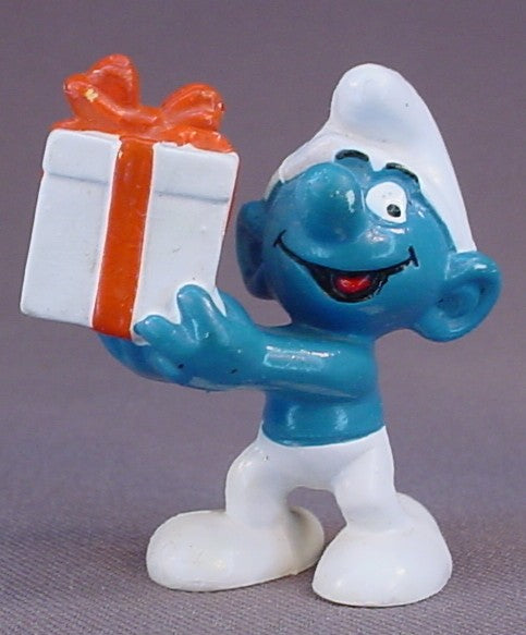 Gift Smurf Carrying A White Present With An Orange Bow PVC Figure, #20086, 1975 Peyo Bully, West Germany, Smurfs, Vintage, Figurine