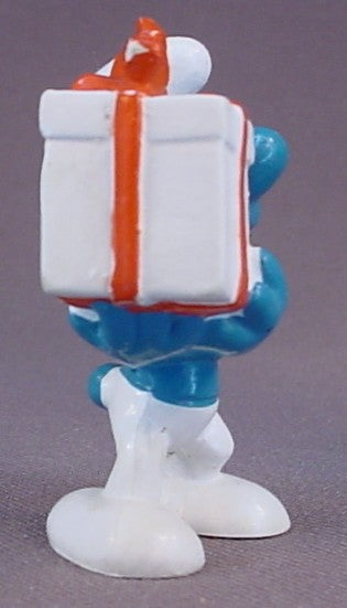 Gift Smurf Carrying A White Present With An Orange Bow PVC Figure, #20086, 1975 Peyo Bully, West Germany, Smurfs, Vintage, Figurine