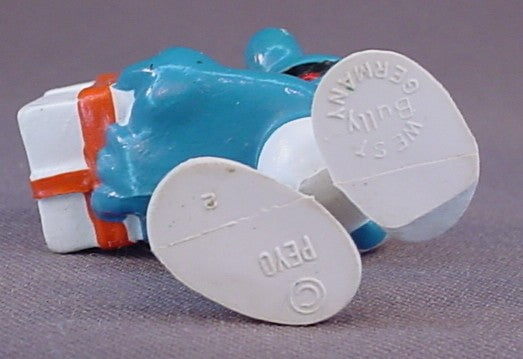 Gift Smurf Carrying A White Present With An Orange Bow PVC Figure, #20086, 1975 Peyo Bully, West Germany, Smurfs, Vintage, Figurine