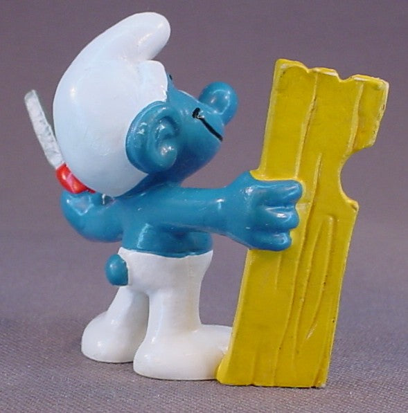 Carpenter Smurf Holding A Saw & A Piece Of Wood PVC Figure, #20112, 1980 Peyo Bully, West Germany, Smurfs, Vintage, Figurine