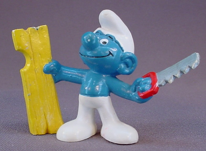 Carpenter Smurf Holding A Saw & A Piece Of Wood PVC Figure, #20112, 1980 Peyo Bully, West Germany, Smurfs, Vintage, Figurine
