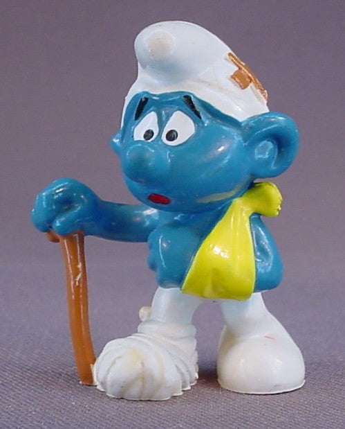 Injured Smurf With His Arm In A Sling & A Bandaged Foot PVC Figure, Walking With A Cane, #20097, 1978 Peyo Bully, West Germany, Smurfs, Vintage, Figurine