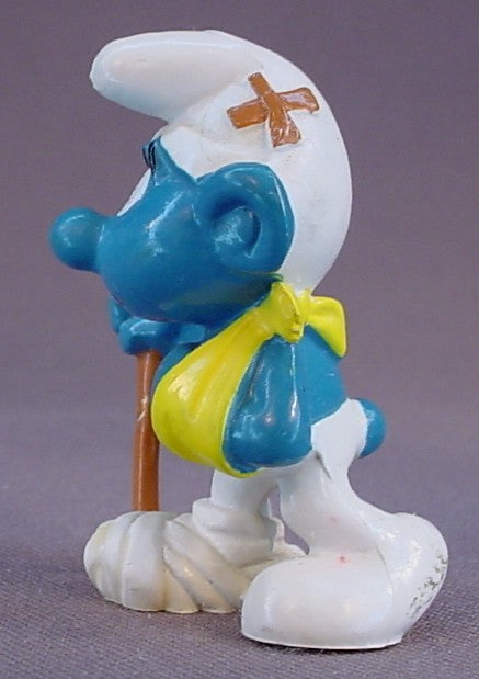 Injured Smurf With His Arm In A Sling & A Bandaged Foot PVC Figure, Walking With A Cane, #20097, 1978 Peyo Bully, West Germany, Smurfs, Vintage, Figurine