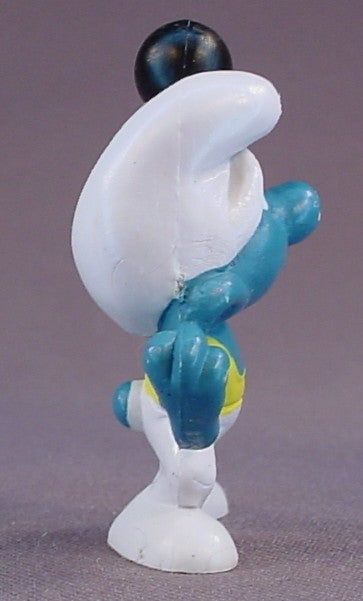 Smurf Wearing White & Yellow Tights & Holding A Black Barbell PVC Figure, #20020, 1972 Peyo, Made In Portugal, Smurfs, Vintage, Figurine, Mustard Yellow Dot