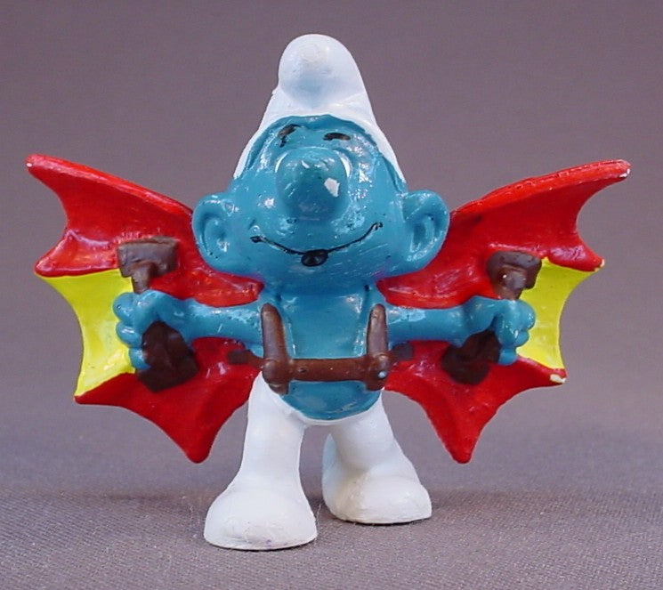 Hang Glider Smurf With Red & Yellow Bat Shaped Wings With Brown Straps PVC Figure, #20036, 1978 Peyo, Made In Portugal, Smurfs, Vintage, Figurine