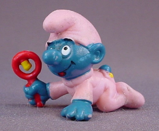 Baby Smurf In A Pink Sleeper & Holding A Rattle PVC Figure, #20202, 1984 Peyo Schleich, Smurfs, Vintage, Figurine, W. Berrie & Co.