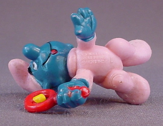 Baby Smurf In A Pink Sleeper & Holding A Rattle PVC Figure, #20202, 1984 Peyo Schleich, Smurfs, Vintage, Figurine, W. Berrie & Co.