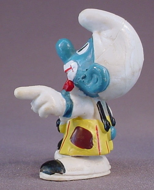 Smurf Clown Pointing His Finger PVC Figure, Yellow Pants With Black Suspenders, #20033, 1978 Peyo Schleich, Smurfs, Vintage, Figurine, Has Cracking In The Paint On His Hat, Mustard Yellow Or Orange Dot