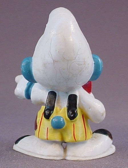 Smurf Clown Pointing His Finger PVC Figure, Yellow Pants With Black Suspenders, #20033, 1978 Peyo Schleich, Smurfs, Vintage, Figurine, Has Cracking In The Paint On His Hat, Mustard Yellow Or Orange Dot