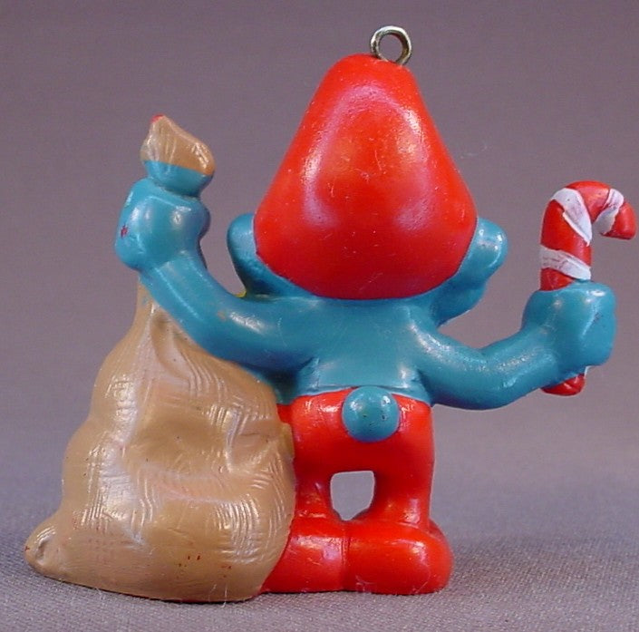 Santa Claus Papa Smurf PVC Figure Ornament, Has A Bag Of Presents & A Candy Cane, #20124, 1981 Peyo Schleich, Made In Portugal, Smurfs, Vintage, Figurine