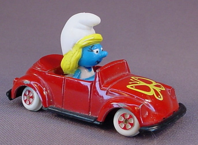 Smurfette Driving A Red Diecast Metal Convertible Car With A Butterfly Design, The Axles Are Bent So It Doesn't Roll True, Smurfs, Vintage, Figurine, Die-Cast, 1983 The ERTL Co., Wallace Berrie & Co., Hong Kong