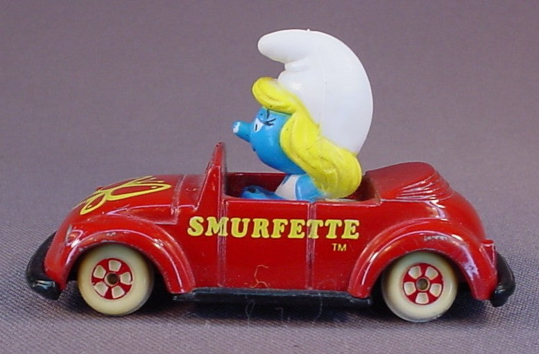 Smurfette Driving A Red Diecast Metal Convertible Car With A Butterfly Design, The Axles Are Bent So It Doesn't Roll True, Smurfs, Vintage, Figurine, Die-Cast, 1983 The ERTL Co., Wallace Berrie & Co., Hong Kong