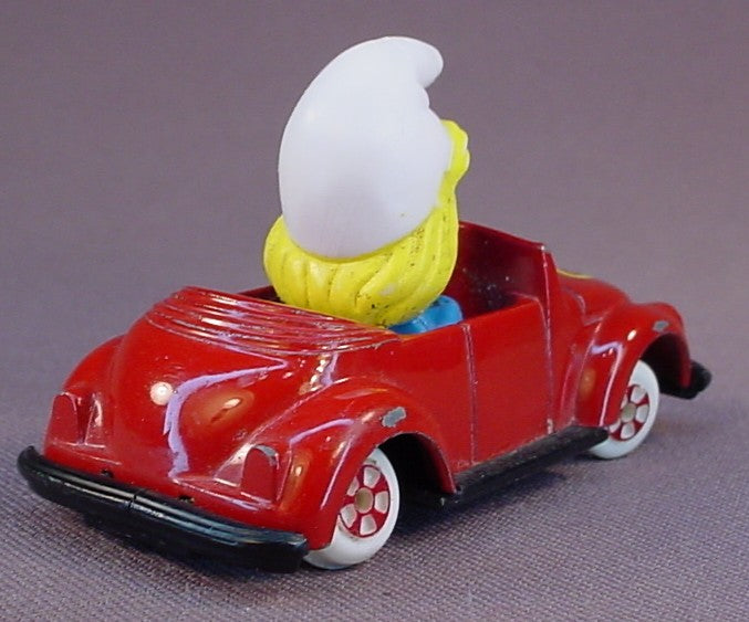 Smurfette Driving A Red Diecast Metal Convertible Car With A Butterfly Design, The Axles Are Bent So It Doesn't Roll True, Smurfs, Vintage, Figurine, Die-Cast, 1983 The ERTL Co., Wallace Berrie & Co., Hong Kong