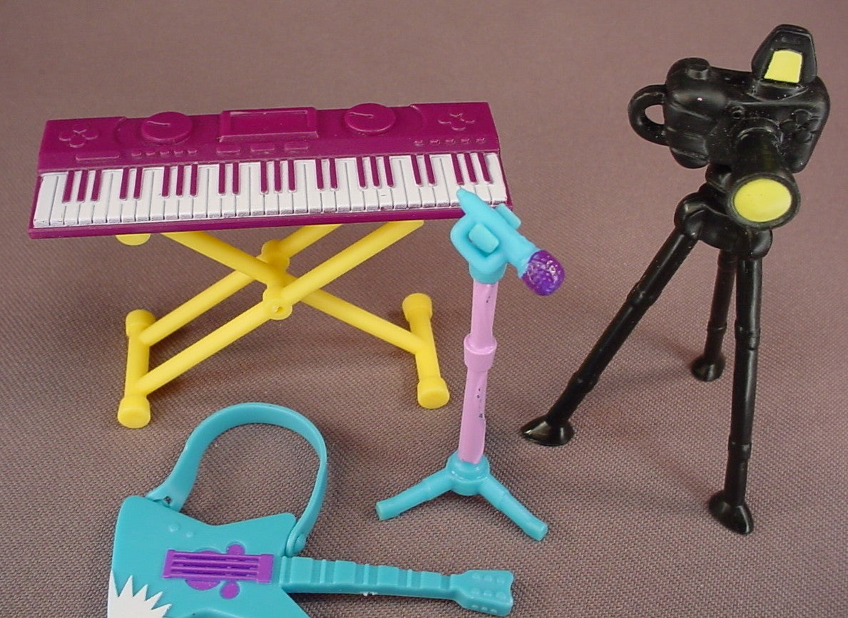 Littlest Pet Shop Set Of 4 Accessories From A Totally Talented Pet Band Set, Keyboard With Removable Stand, Electric Guitar, Microphone On A Stand, Tripod And Removable Camera, Hasbro