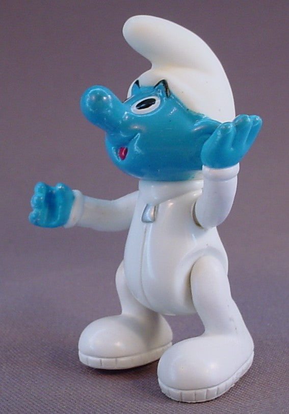 Astrosmurf Smurf Figure, 3 Inches Tall, From A 1996 The Smurfs Saturn Ride Play Set, Has A Vinyl Head And Spring Loaded Arms, The Legs Move, The Head Turns, 1995 Peyo Imps, Brussels, Irwin