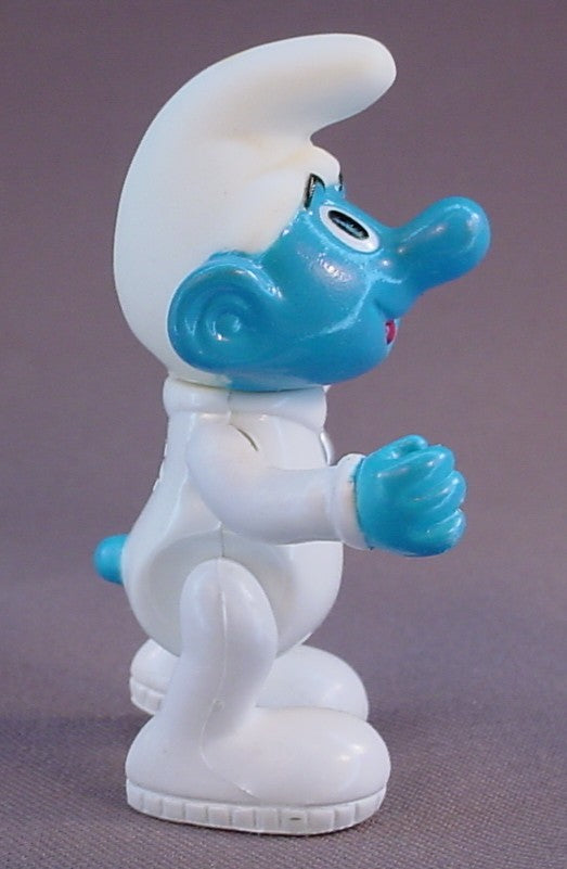 Astrosmurf Smurf Figure, 3 Inches Tall, From A 1996 The Smurfs Saturn Ride Play Set, Has A Vinyl Head And Spring Loaded Arms, The Legs Move, The Head Turns, 1995 Peyo Imps, Brussels, Irwin