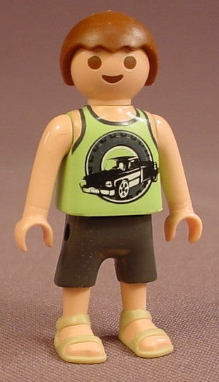 Playmobil Male Boy Child Figure In A Light Or Linden Green Tank Top Shirt With A Black Truck Design, Dark Gray Shorts, Bare Arms, Light Brown Or Tan Sandals, Brown Hair, 5267 6866, 30 10 3020
