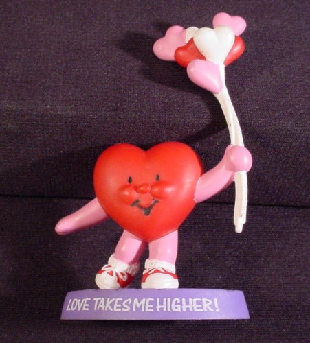 Avon Valentine's Heart Holding Ballons On Base With Message PVC Fig