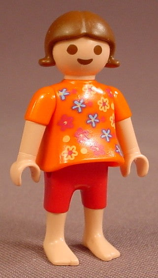 Playmobil Female Girl Child Figure In An Orange Shirt With Red Blue & Yellow Flowers, Dark Pink Shorts, Bare Feet, Brown Hair With Flipped Tips, 3656, 30 11 1230