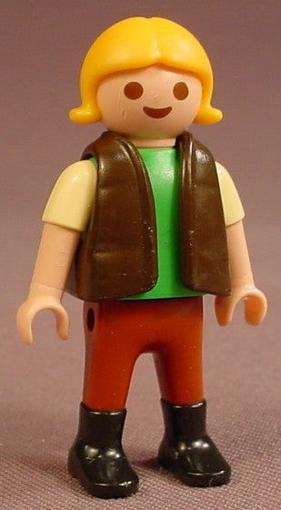 Playmobil Female Girl Child Figure In A Dark Brown Down Vest Over A Green Shirt With Light Yellow Short Sleeves, Brown Pants, Black Boots, Yellow Or Blonde Hair With Flipped Tips, 4159 4167, 30 11 2040