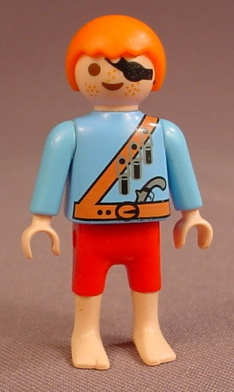 Playmobil Male Boy Child Pirate Figure With An Eye Patch, Orange Bandolier With Bullets, Orange Belt With A Pistol Tucked Into It, Red Shorts, Light Blue Shirt, Bare Feet, Orange Or Red Hair, 4331