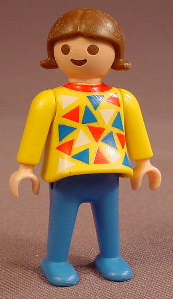 Playmobil Female Girl Child Figure In A Long Sleeve Yellow Shirt With A Red Blue & Red Triangle Design, Blue Pants & Shoes, Red Collar, Brown Hair With Flipped Tips, 3084 3071, K3084B