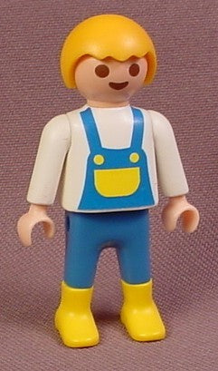 Playmobil Male Boy Child Figure In Blue Overalls With A Yellow Bib